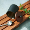 Shown in matte black stainless steel and dark walnut mango wood.