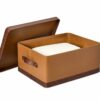 Shown in cognac and distressed brown faux leather, antique brass stainless steel, and chocolate mango wood. Shown in cognac and distressed brown faux leather, antique brass stainless steel, and chocolate mango wood.