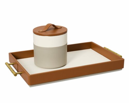 Shown in light textured grey, ivory, and cognac faux leather and antique brass stainless steel.